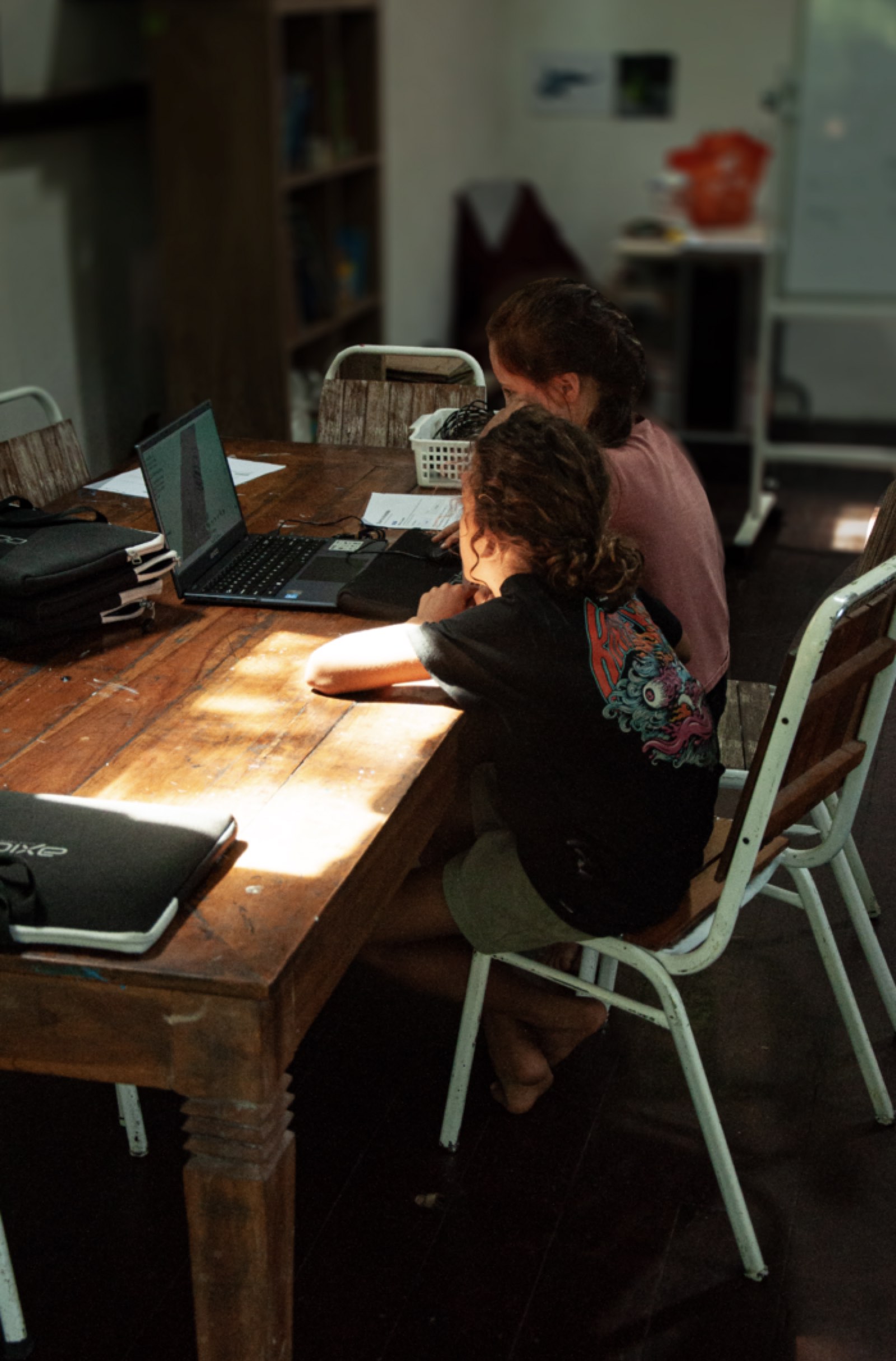 Students working together on a project at Wisdom Academy